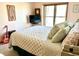 Bedroom with a light green quilt, large window, and a small TV at 2509 Windsor Ct, Lebanon, IN 46052