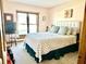 Bedroom with a light green quilt, large window, guitar, and a small TV at 2509 Windsor Ct, Lebanon, IN 46052