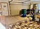 Garage with a neutral-colored carpeted floor, metal garage door and a storage space at 2509 Windsor Ct, Lebanon, IN 46052