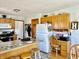 Kitchen with wood cabinets, stainless steel appliances, and a breakfast bar. A workspace is conveniently nearby at 2509 Windsor Ct, Lebanon, IN 46052