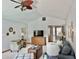 Bright living room featuring a ceiling fan, comfortable seating, and plenty of natural light at 2509 Windsor Ct, Lebanon, IN 46052