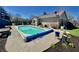 Backyard featuring an in-ground pool, patio area, and manicured landscaping, creating a private outdoor retreat at 2509 Windsor Ct, Lebanon, IN 46052