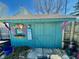 Quaint backyard shed with decorative touches, providing extra storage space while adding charm to the landscape at 2509 Windsor Ct, Lebanon, IN 46052