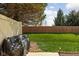 This backyard is fenced and contains manicured lawn and a patio at 253 Provincial Ln # Apt D, Avon, IN 46123