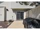 Back patio features access to an air conditioning unit and sliding glass door at 253 Provincial Ln # Apt D, Avon, IN 46123