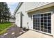 Home exterior featuring siding, a small patio, an A/C unit, and a manicured lawn with stepping stones at 253 Provincial Ln # Apt D, Avon, IN 46123