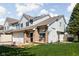 Inviting townhome showcasing lush green lawn and brick accents at 253 Provincial Ln # Apt D, Avon, IN 46123