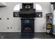 Elegant living room with a black fireplace, tv, and modern decor at 253 Provincial Ln # Apt D, Avon, IN 46123
