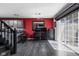 Bright living area featuring a workspace, sliding glass door, and sleek gray cabinets at 253 Provincial Ln # Apt D, Avon, IN 46123