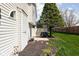 Home exterior with a small patio area, grill, and lush landscaping, providing a cozy outdoor space at 253 Provincial Ln # Apt D, Avon, IN 46123