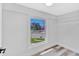 Empty bedroom with a large window providing natural light and an open closet at 2531 E Brookside Ave, Indianapolis, IN 46218