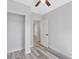 Well-lit bedroom offers a closet, ceiling fan and stylish wood-look floors at 2531 E Brookside Ave, Indianapolis, IN 46218