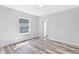 Bright bedroom featuring neutral paint and flooring, a window, and natural light at 2531 E Brookside Ave, Indianapolis, IN 46218