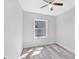 Neutral bedroom featuring modern flooring, a ceiling fan and lots of natural light at 2531 E Brookside Ave, Indianapolis, IN 46218
