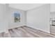 Bright living room featuring wood-look floors, neutral paint and a window view at 2531 E Brookside Ave, Indianapolis, IN 46218