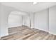 Open-concept living area with wood-look floors and neutral paint at 2531 E Brookside Ave, Indianapolis, IN 46218