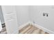 Unfinished room featuring new floors with water hookups and electrical outlets at 2531 E Brookside Ave, Indianapolis, IN 46218