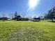View of the fenced in backyard and shed, with a lush green lawn at 2575 S Indianapolis Rd, Lebanon, IN 46052