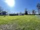 Large backyard with an expansive lawn, partially enclosed by a wooden fence at 2575 S Indianapolis Rd, Lebanon, IN 46052