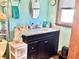 Well-lit bathroom with a vanity, granite countertop, and decorative accents at 2575 S Indianapolis Rd, Lebanon, IN 46052