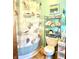 Bathroom featuring a shower with a whimsical seashell themed curtain and a decorative chrome shelving unit at 2575 S Indianapolis Rd, Lebanon, IN 46052