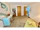 Bedroom featuring a desk, some doors and an ottoman at 2575 S Indianapolis Rd, Lebanon, IN 46052