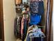 Organized closet with clothing racks, shelves, and personal belongings at 2575 S Indianapolis Rd, Lebanon, IN 46052