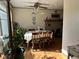 Dining room featuring a fireplace, a ceiling fan, and a table set for a Gathering meal at 2575 S Indianapolis Rd, Lebanon, IN 46052