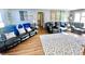 Inviting living room featuring plush black leather seating, a patterned rug, and neutral wall colors at 2575 S Indianapolis Rd, Lebanon, IN 46052