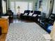 The living room features laminate floors, neutral walls, and black leather furniture at 2575 S Indianapolis Rd, Lebanon, IN 46052