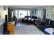 Spacious living room featuring black leather furniture, neutral walls, and laminate floors at 2575 S Indianapolis Rd, Lebanon, IN 46052
