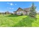 Well-maintained lawn with mature landscaping and enclosed porch; idyllic outdoor living space at 2601 Viceroy Ln, Lebanon, IN 46052