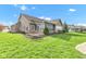 Beautiful backyard featuring a well-maintained lawn, screened porch, and meticulously landscaped yard at 2601 Viceroy Ln, Lebanon, IN 46052