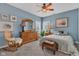 Cozy bedroom with a ceiling fan, warm paint colors, and comfortable furnishings at 2601 Viceroy Ln, Lebanon, IN 46052
