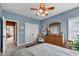 Bedroom with a ceiling fan, comfortable furnishings, and view through a doorway at 2601 Viceroy Ln, Lebanon, IN 46052