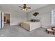 Bright bedroom with large bed, blue accents, and natural light from a nearby window at 2601 Viceroy Ln, Lebanon, IN 46052