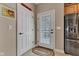 Inviting entryway with neutral tones, white doors, stainless steel fridge and tiled floor at 2601 Viceroy Ln, Lebanon, IN 46052