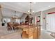 Open kitchen boasts an island, tile floors, granite countertops, and stainless steel appliances at 2601 Viceroy Ln, Lebanon, IN 46052