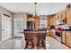 Well-lit kitchen with ample cabinet space, an island, stainless steel appliances, and tile flooring at 2601 Viceroy Ln, Lebanon, IN 46052