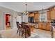 Kitchen featuring an island with bar seating, stainless steel appliances, and tile flooring at 2601 Viceroy Ln, Lebanon, IN 46052