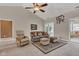 Cozy living room features a ceiling fan, vaulted ceilings, and french doors to sunroom at 2601 Viceroy Ln, Lebanon, IN 46052