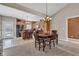 View of the dining room connected to the kitchen featuring a breakfast bar with seating at 2601 Viceroy Ln, Lebanon, IN 46052
