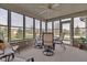 Cozy porch with comfortable chairs and large windows showcasing neighborhood views at 2601 Viceroy Ln, Lebanon, IN 46052