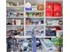 Organized storage room with shelves filled with various household items and storage containers at 2601 Viceroy Ln, Lebanon, IN 46052