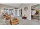 Inviting sunroom with French doors, large windows, and comfortable seating at 2601 Viceroy Ln, Lebanon, IN 46052