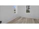 Bright, spacious bedroom with neutral walls and modern wood-look floors at 2631 Collier St, Indianapolis, IN 46241