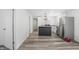 Open kitchen featuring modern appliances, an island, and an open floor plan at 2631 Collier St, Indianapolis, IN 46241