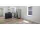 Stylish kitchen featuring stainless steel appliances, island and wood-look flooring at 2631 Collier St, Indianapolis, IN 46241