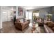 Inviting living room boasts natural light, modern floors, stylish decor, and comfortable seating at 3021 Midvale Dr, Indianapolis, IN 46222