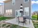 Backyard patio with outdoor dining set, umbrella, and view of the backyard and the home's exterior at 3053 Creekridge Ct, Columbus, IN 47201